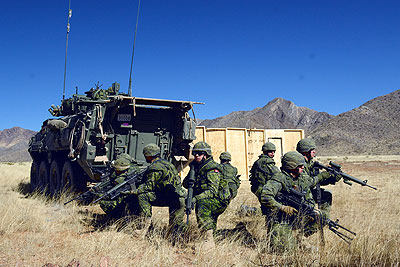 Canadian soldiers dismounting APC