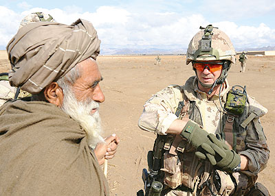 Canadian soldier with Afghan village elder