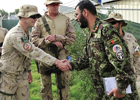 CO Health Services Unit (HSU) (left) greets the DComd Kandahar Regional Medical Hospital (KRMH), at CAMP HERO