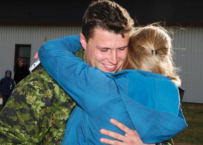 Aircraft Technician from 14 Wing Greenwood is greeted by his loved one after arriving home from Operation Mobile