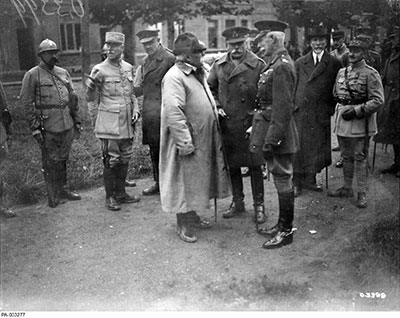 French Prime Minister Georges Clemenceau (fourth from left) in discussion with Field Marshal Sir Douglas Haig (fourth from right).