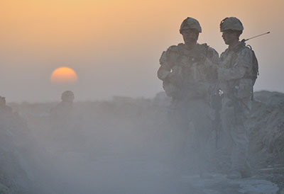 As the sun rises in the Panjwai’i District, Lieutenant Andrew McCuish (left) and Master Corporal Adam Rymes, along with other soldiers from the Reconnaissance Squadron, 1st Battalion, The Royal Canadian Regiment Battle Group, conduct a patrol to further develop their knowledge of the area and continue to build positive relations with the locals. 