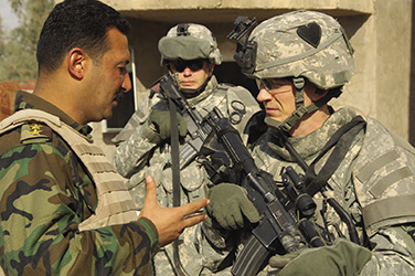 US Army and Iraqi officers in consultation