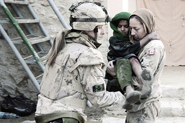 female soldiers with Afghan child