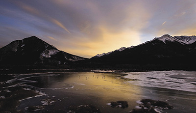 A frozen lake at dusk near Banff, Alberta