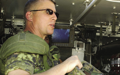 Major-General Andrew Leslie, Deputy Commander ISAF, in a Light Armoured Vehicle (LAV III) prior to departing Camp Julien for a tour of the Canadian Area of Operations in Kabul, 30 October 2003.