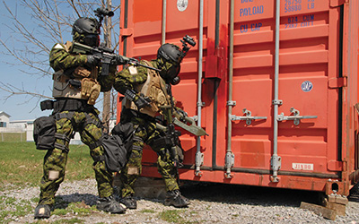 SOF personnel in action at storage container