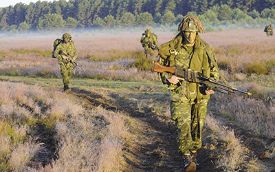 Army major leading his paratroopers to a staging area during a reassurance exercise in Poland