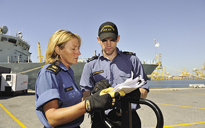 Female petty officer consulting subordinate