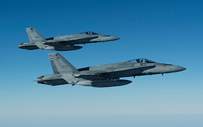 Two CF-18s in formation during Operation ‘Impact’.