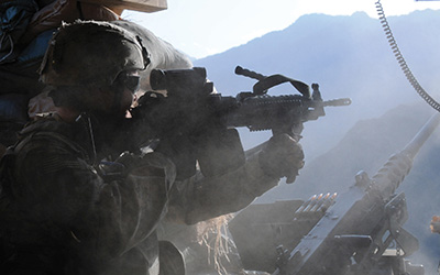 US Army soldier returns fire during an attack on a combat outpost in Afghanistan.