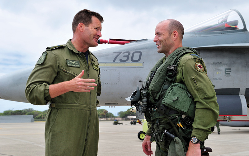 RCAF General Officer and subordinate in consultation.